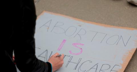 A person making an abortion protest sign