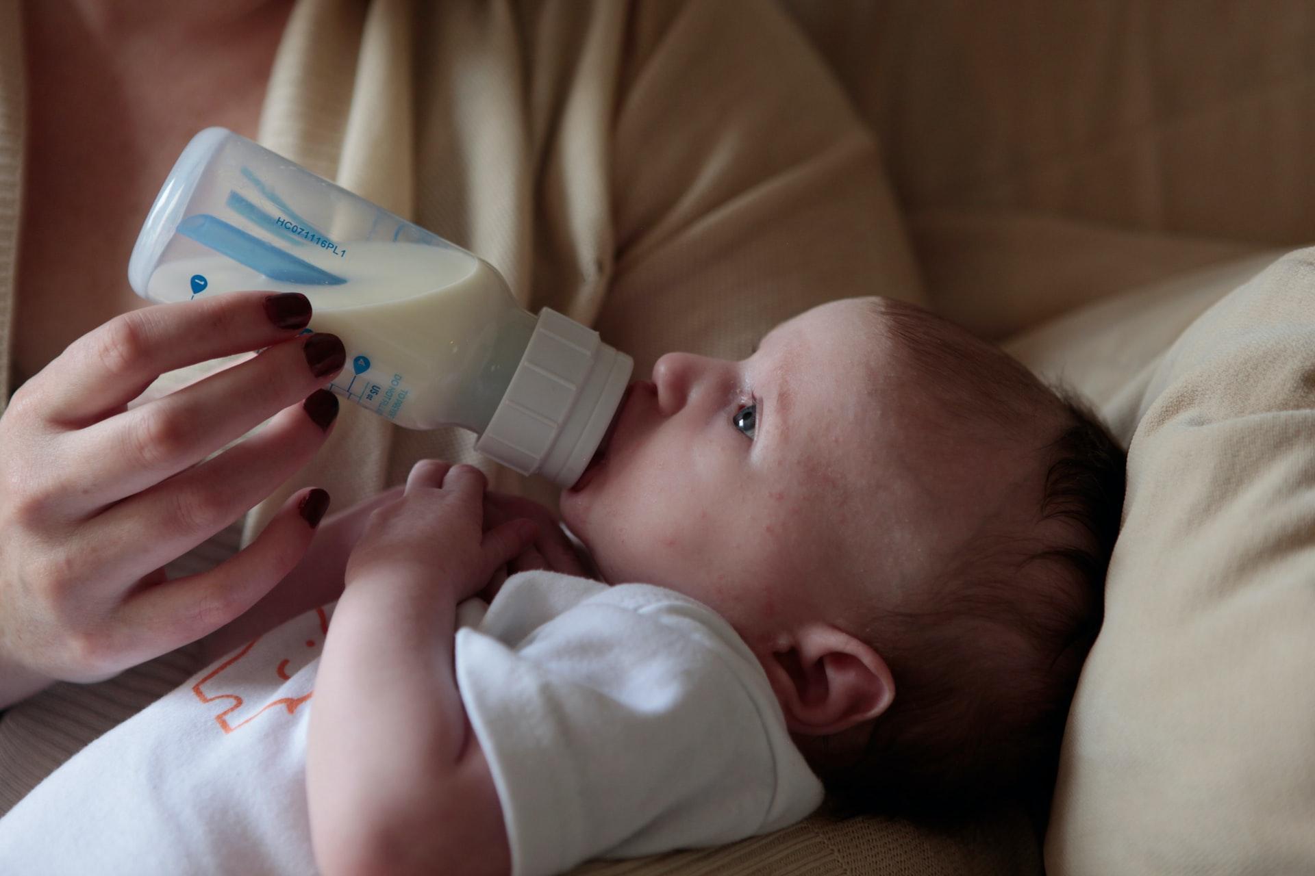 A baby drinking from a bottle