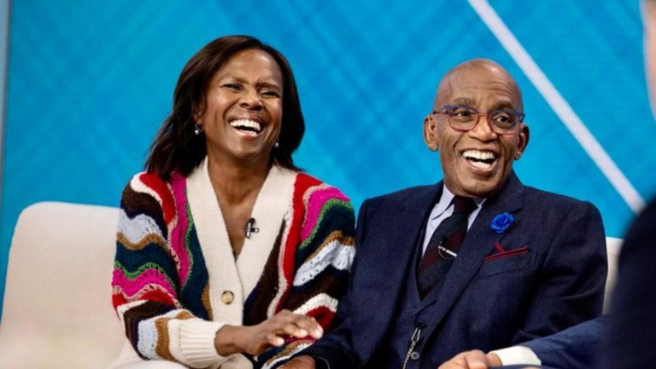 Deborah Roberts and Al Roker laughing on the set of a show.