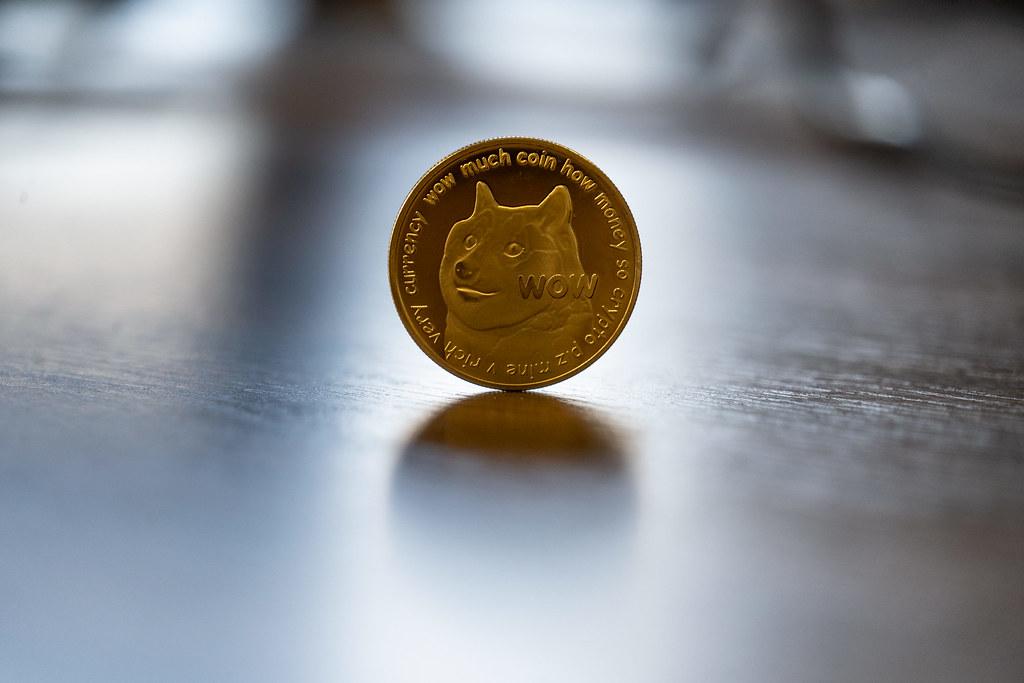 Dogecoin token standing up on a hard surface