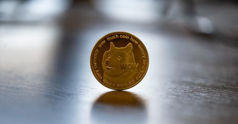 Dogecoin token standing up on a hard surface