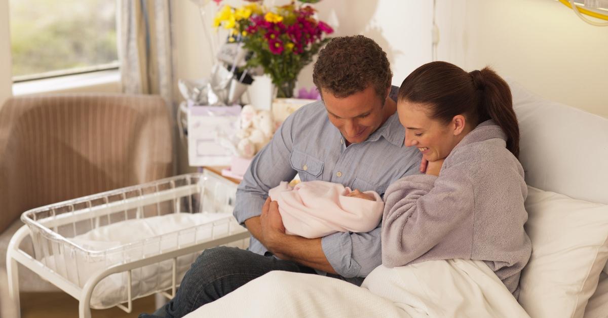 Parents holding a newborn