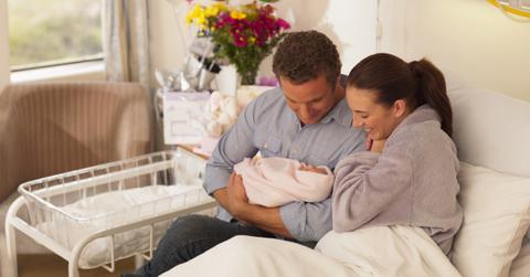 Parents holding a newborn