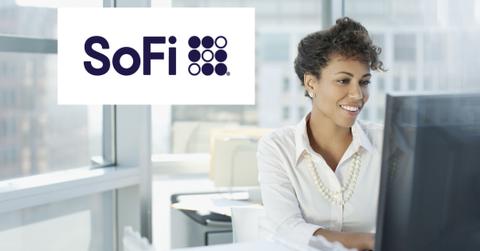 SoFi logo over woman working on computer