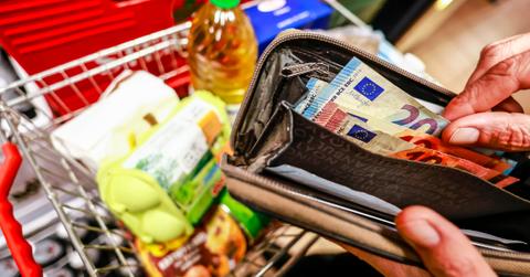 Person shopping at a grocery store amid rising inflation