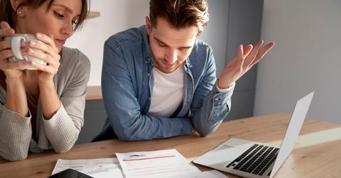 A couple discussing debt repayment