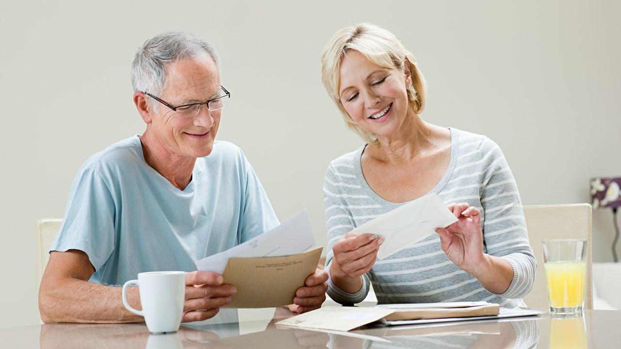 A couple reading their mail