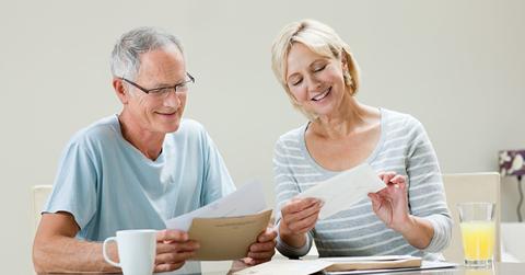 A couple reading their mail