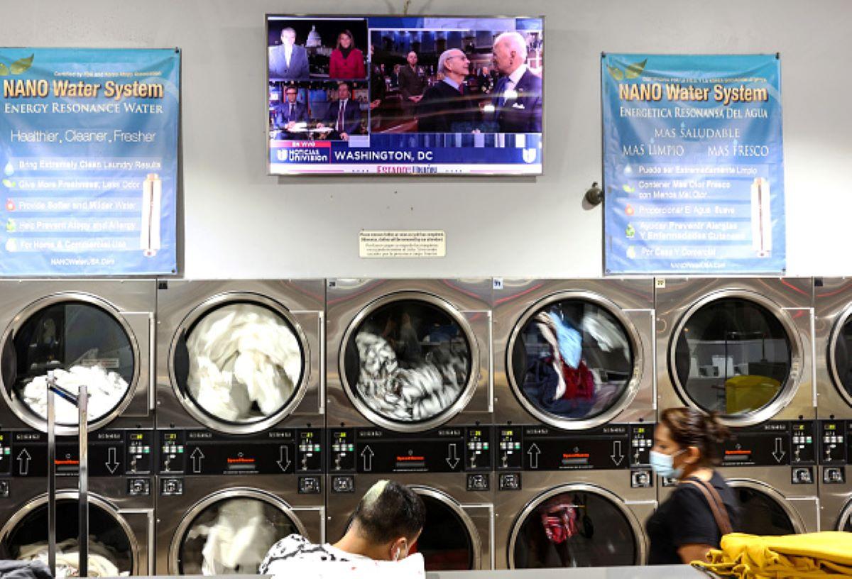 People doing laundry at a laundromat during Biden's State of the Union address