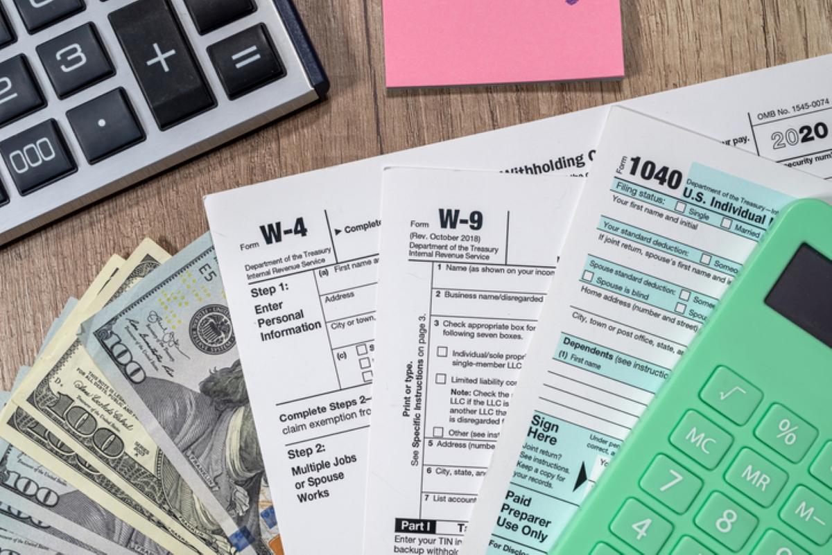 tax documents cash and a calculator