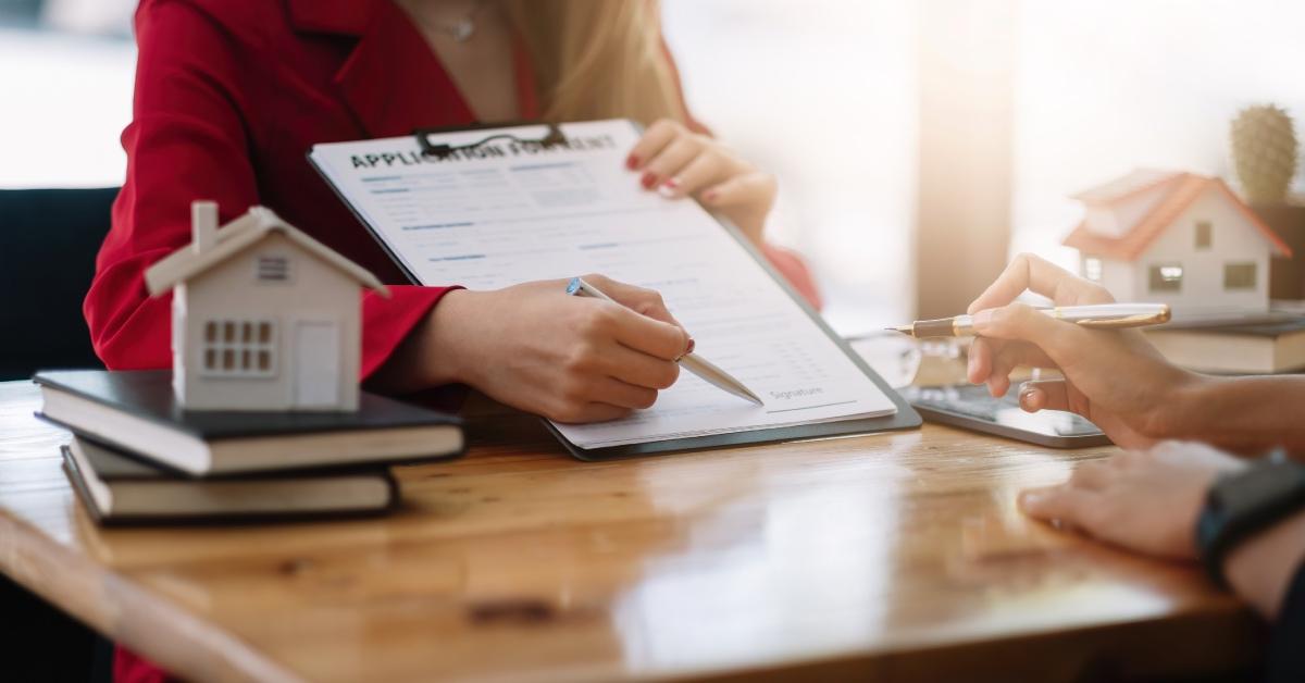 A person signing a rental application