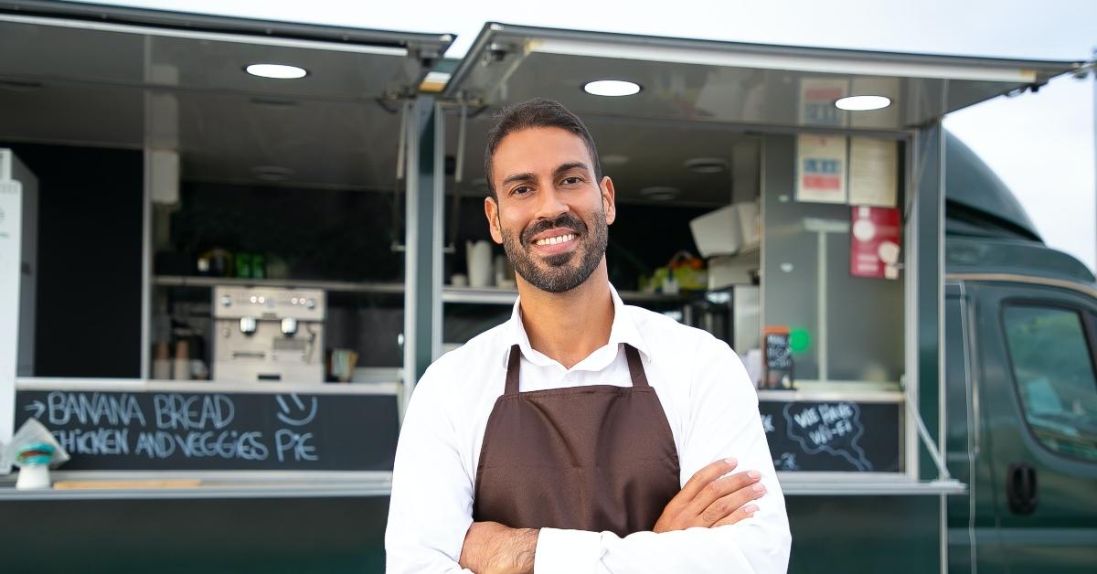 Man standing in front of his food truck