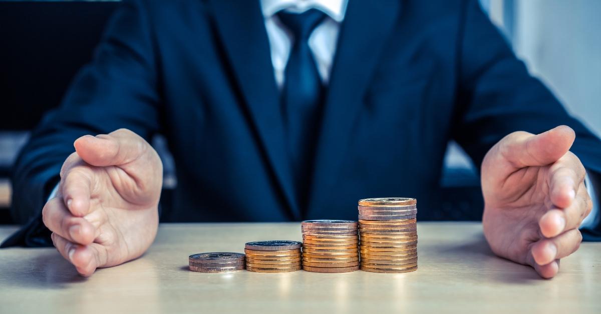 A businessman working with coins.