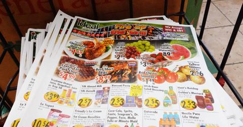 A stack of grocery store flyers