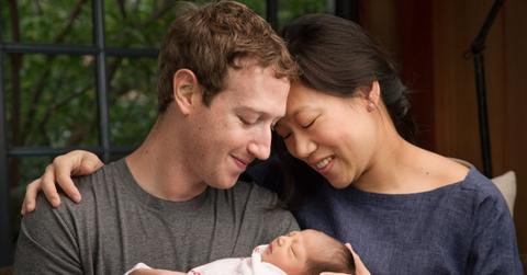 Mark Zuckerberg and Dr. Priscilla Chan holding their baby