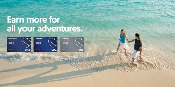 People walking on a beach behind credit card images