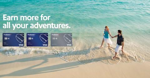People walking on a beach behind credit card images