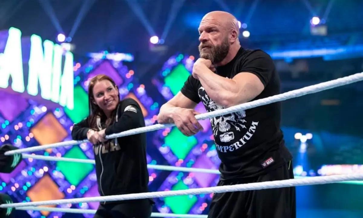 Stephanie McMahon and Paul 'Triple H' Levesque stand in the wrestling ring.