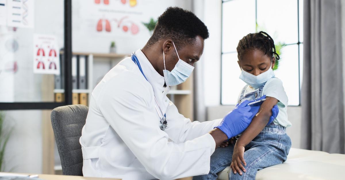 a young child receiving a vaccine