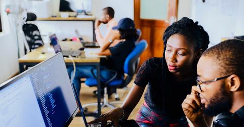 People looking at information on a computer screen
