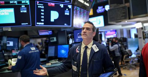 Trader looking at quotes as tech stocks drop