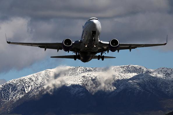 An airplane flying over mountains