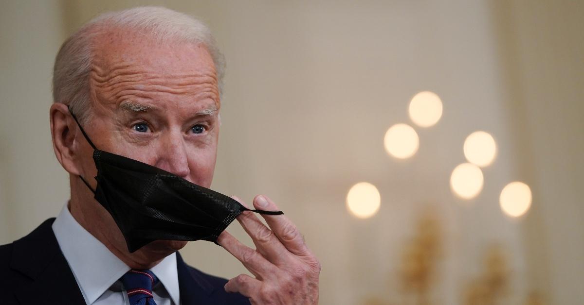 President Biden taking off a mask