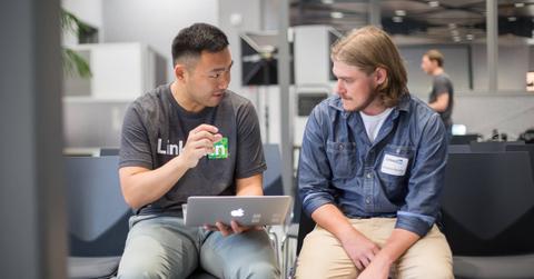 Two men discussing LinkedIn Premium