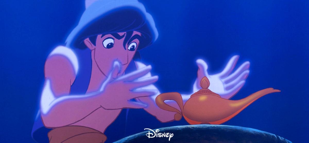 Aladdin looking at the lamp 