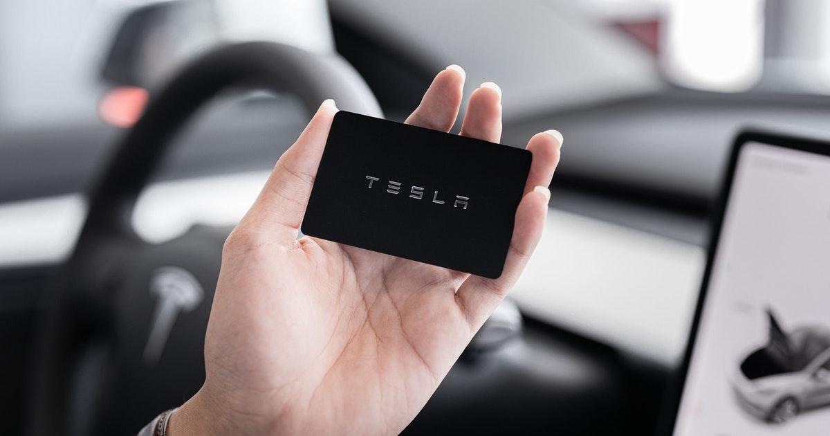 Person looking at a Tesla card