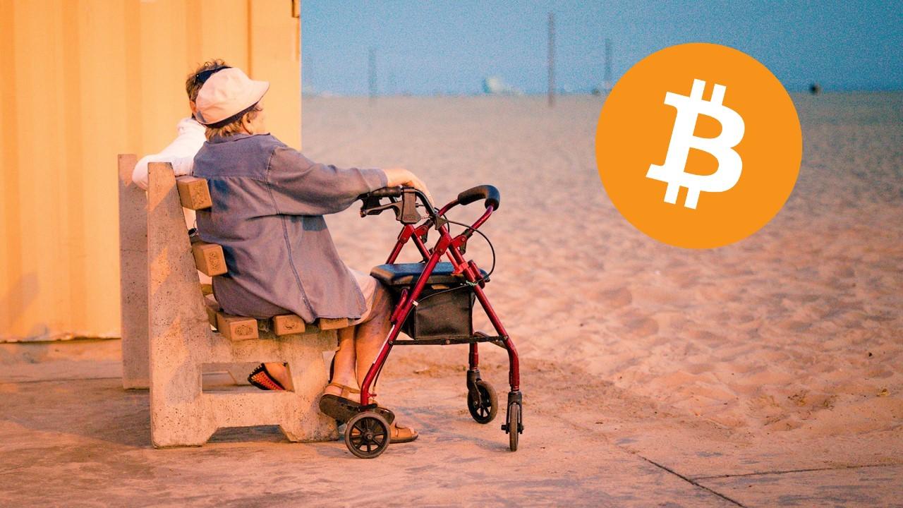 Retired couple sitting on a beach