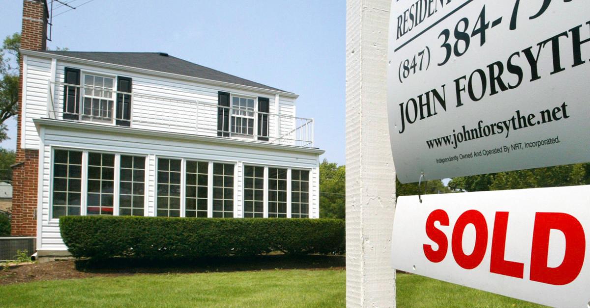 House with realtor sign