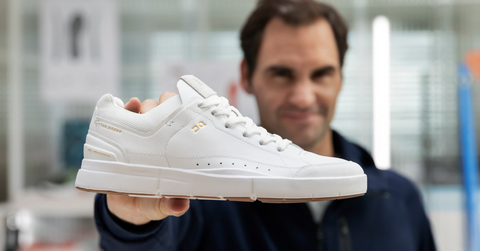 Roger Federer holding On Running shoe