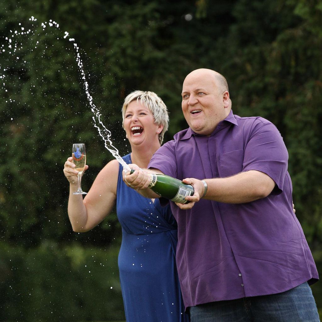 A couple celebrating after a settlement