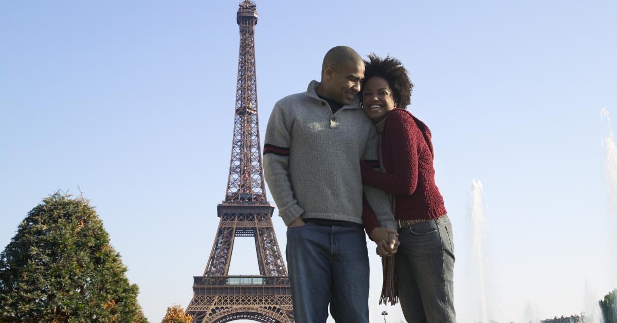 A couple visits Paris. 