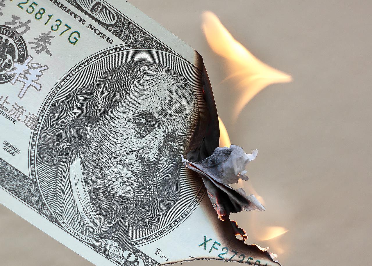 A burning $100 bill