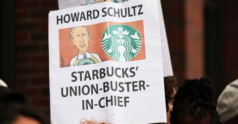 Sign reading Howard Schultz Starbucks' Union-buster-in-chief