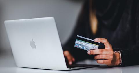 Woman using a laptop and credit card
