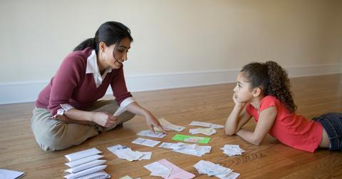 Mother going through bills with daughter