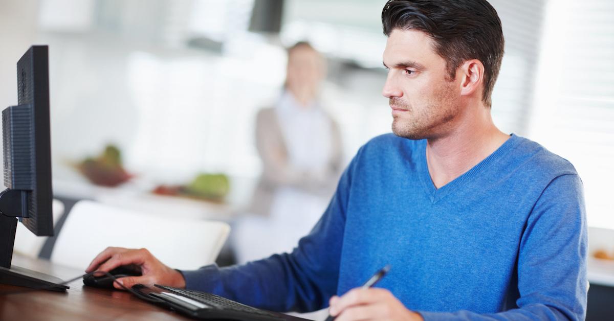 Man on computer doing taxes