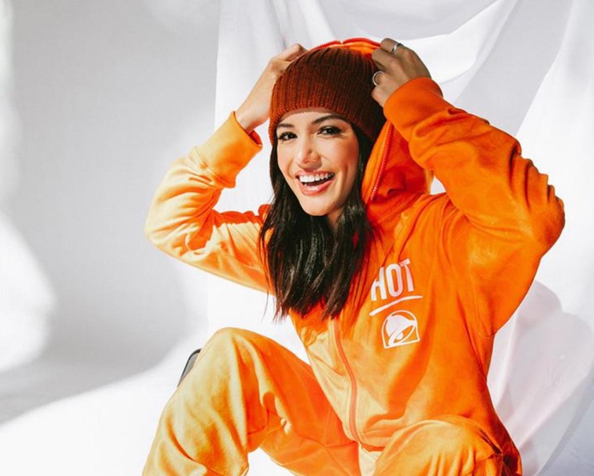 Woman in orange Taco Bell onesie