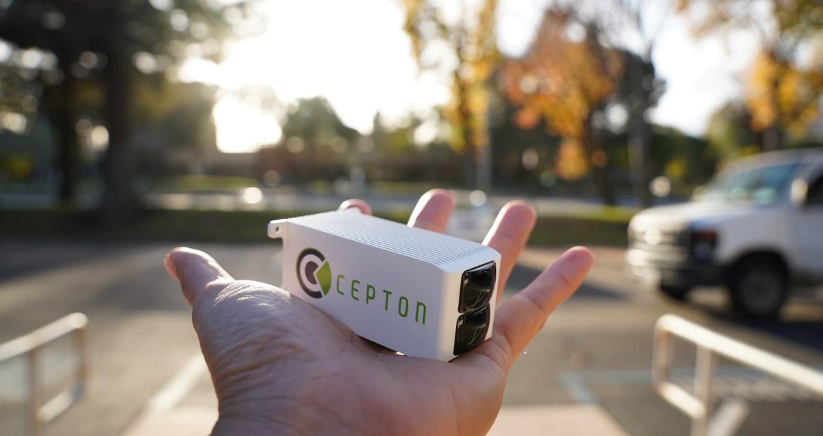 A person holding Cepton lidar technology