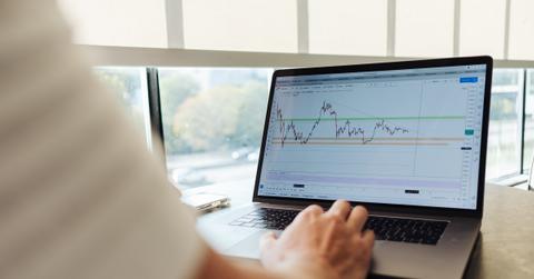 Person searching for pink sheet stocks on a laptop