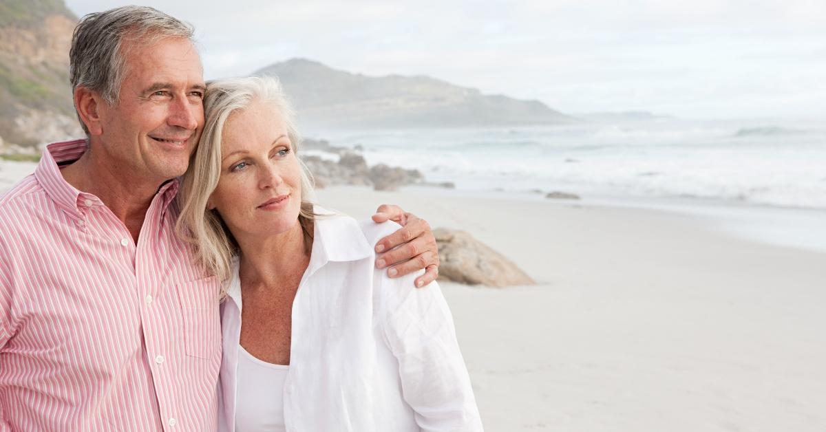 An older couple vacationing at the beach.