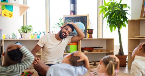 A teacher and kids at a child care facility