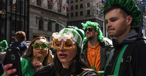 People looking at St. Patrick's Day deal on a smartphone