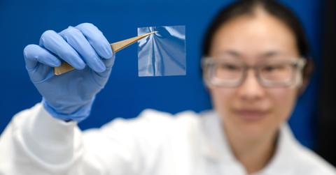 Zymergen chemist with a sample of Hyaline film.