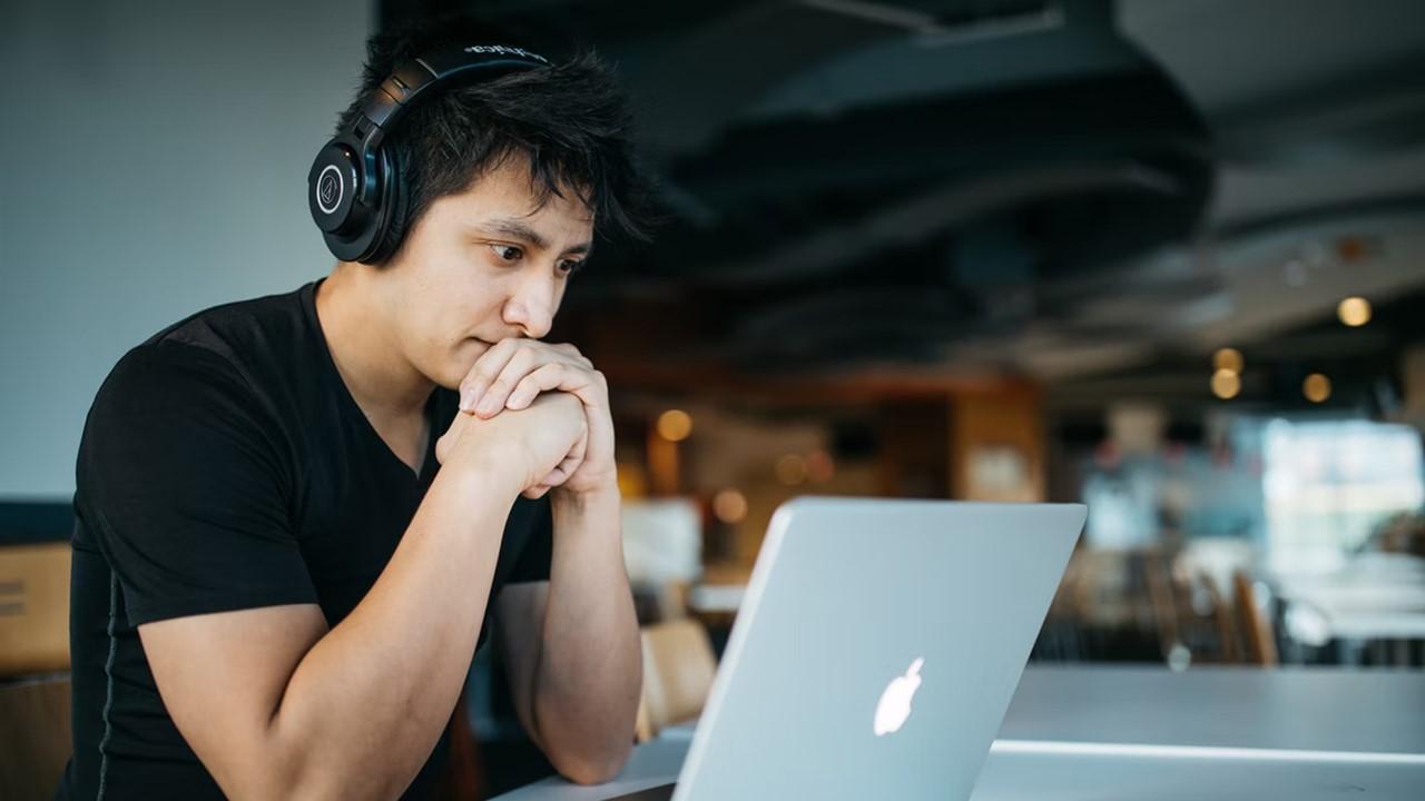 A man looking at a crypto casino on his laptop