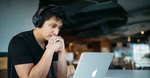 A man looking at a crypto casino on his laptop