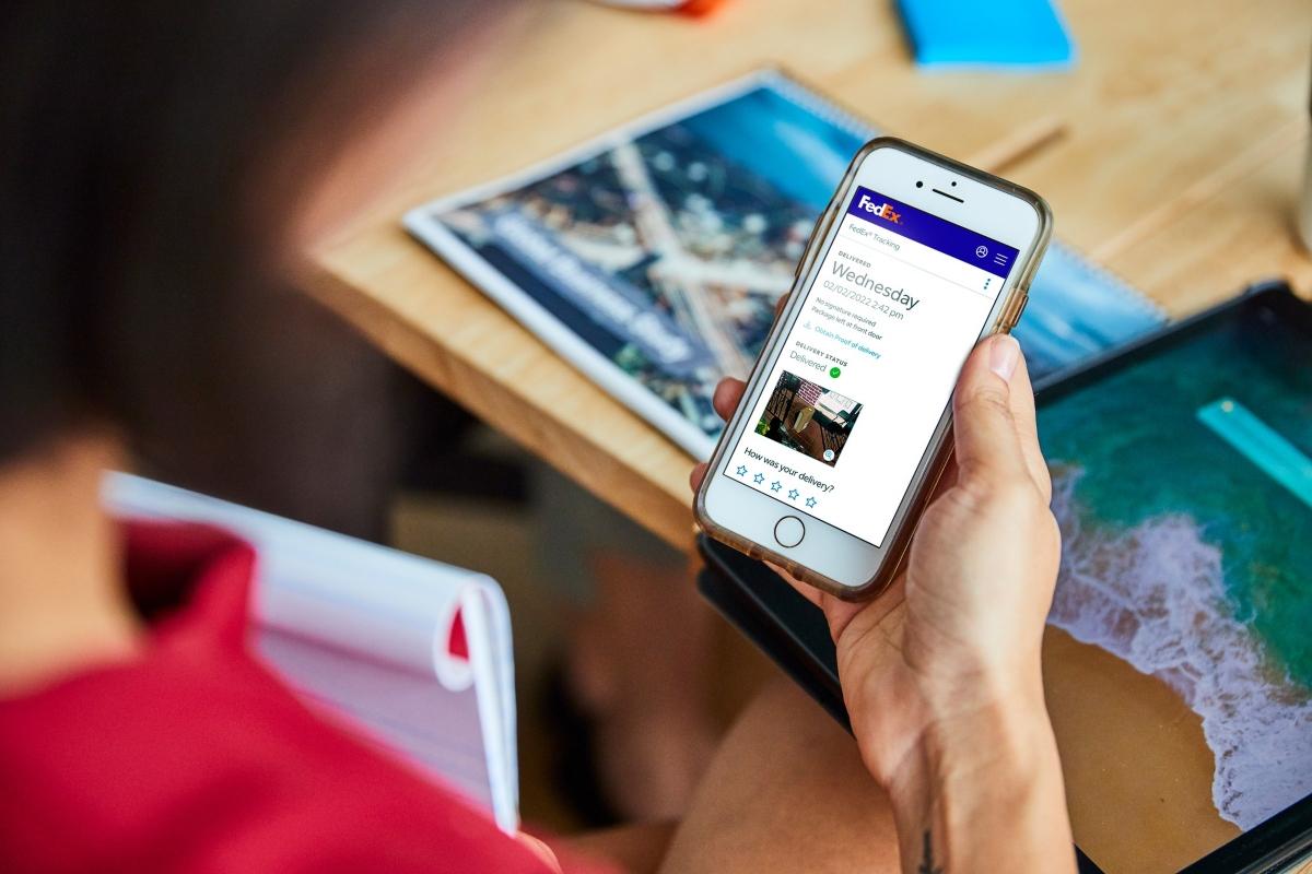 A woman using the FedEx app